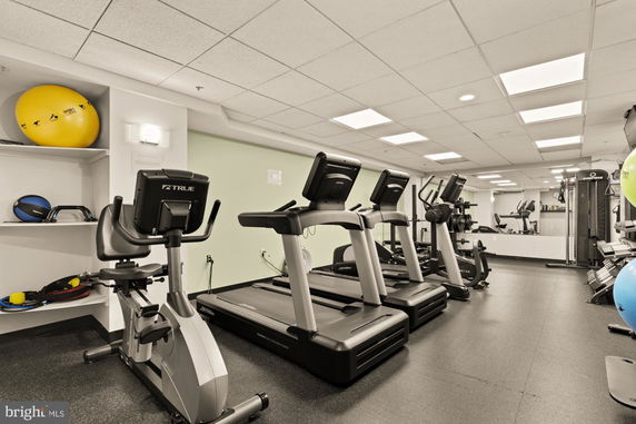 Indoor gym area with exercise equipment and treadmills.