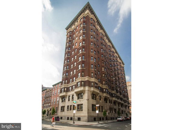 Front view of a multi-story brick apartment building.