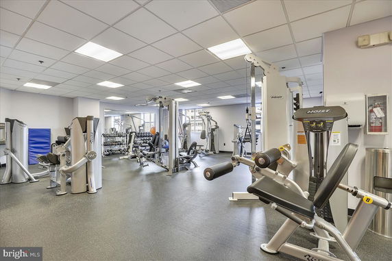 Interior view of a gym area with various exercise machines and equipment.