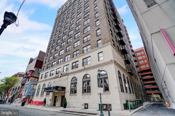 Front view of a high-rise building with a detailed facade.