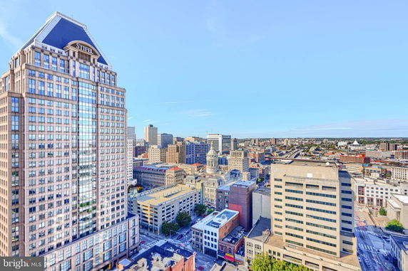 Panoramic view of a city skyline with multiple high-rise buildings.