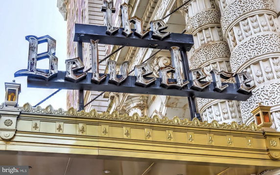 Front view of a building with ornate architectural details and a sign reading 'The Belvedere'.