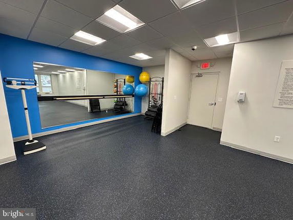 Indoor gym area with exercise balls and fitness equipment.
