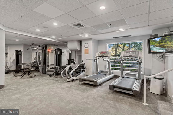 Interior view of a fitness room with exercise machines and treadmills.