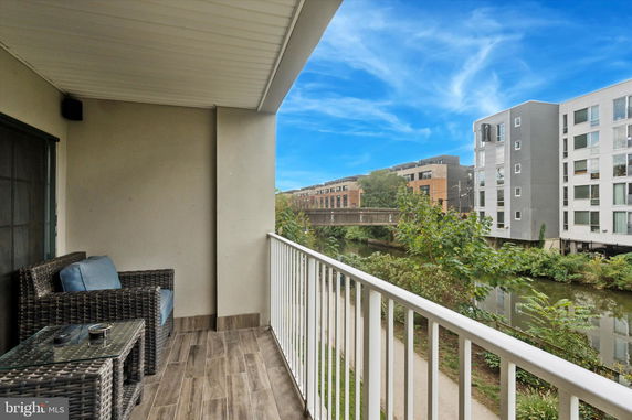 View from a balcony overlooking a canal and surrounding buildings.