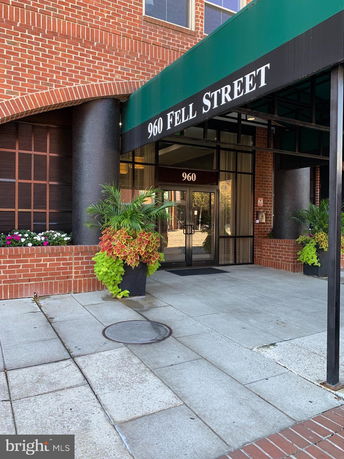 Front view of a building entrance with a canopy labeled '960 Fell Street'.