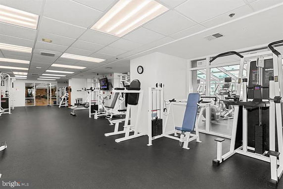 Indoor fitness center with various gym equipment.