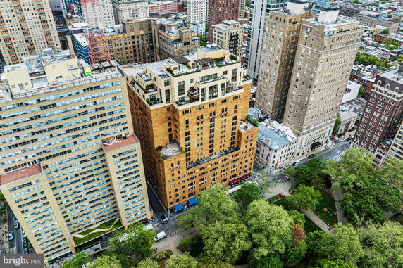 Panoramic aerial view of multiple high-rise buildings in a cityscape.