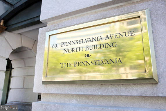 Front view of a building with a name plaque.