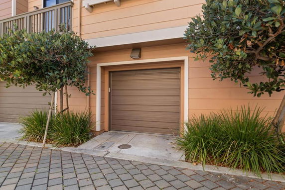 Front view of a house with a single garage door.