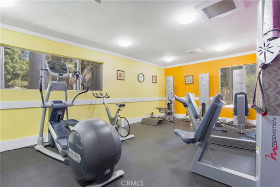 Indoor gym area with various exercise equipment.