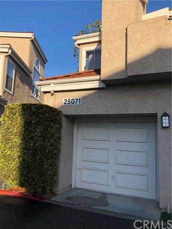 Front view of a house with a single garage.