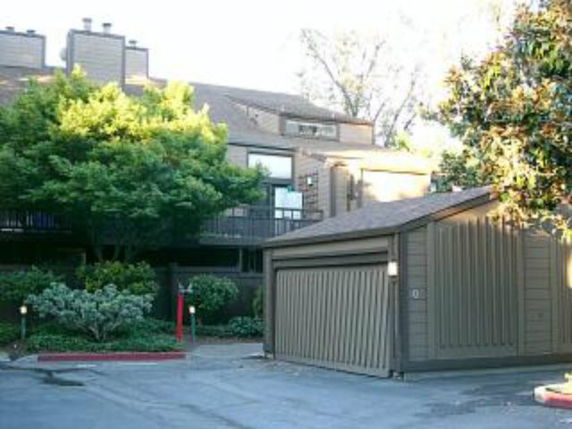 Front view of a multi-story house with a garage.