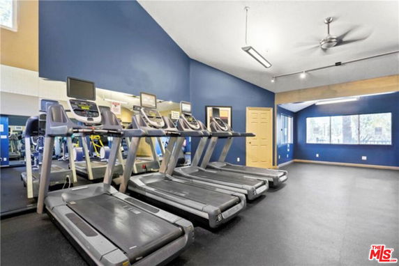 Indoor gym area with treadmills and a mirrored wall.