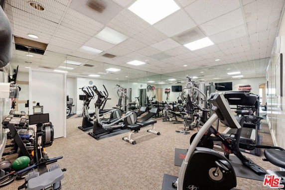 Indoor gym area with various exercise equipment.