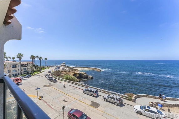 Panoramic view of a coastal area with ocean and road.