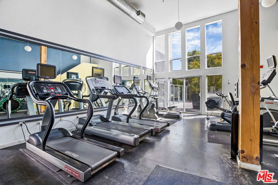 Indoor gym area with treadmills and exercise equipment.