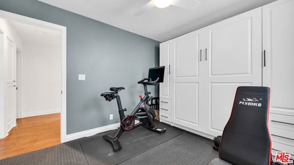 Indoor exercise room with a stationary bike and exercise equipment.
