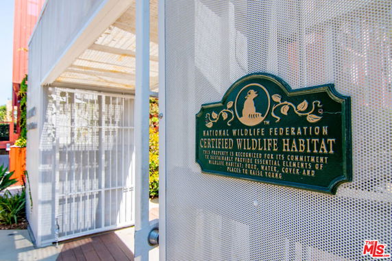 Front view of a building with a certified wildlife habitat plaque.