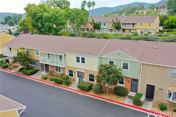 Front view of a row of two-story townhouses.
