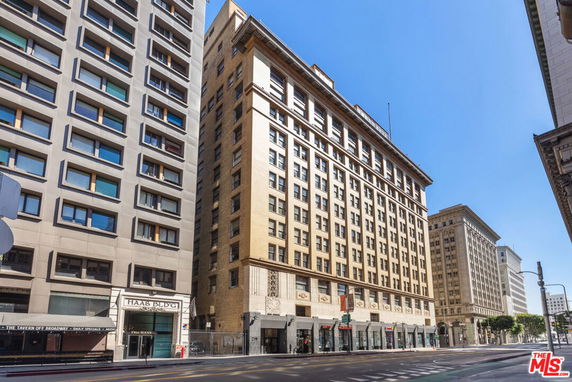 Front view of a multi-story commercial building with a classical facade.
