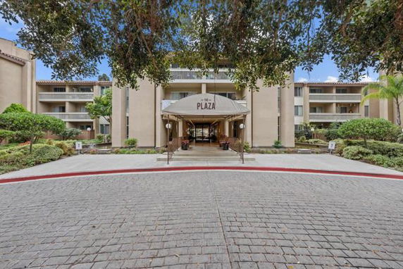 Front view of a multi-story building with an entrance canopy.