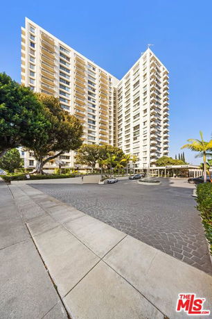 Front view of a tall apartment building.