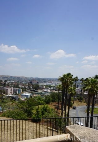 Panoramic view of cityscape and trees from a building