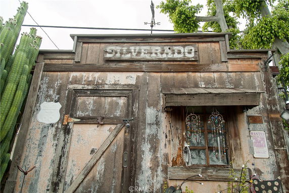Front view of a rustic wooden building with a weathered facade and a sign that reads 'SILVERADO.'