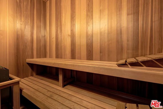 Interior of a wooden sauna room with benches.