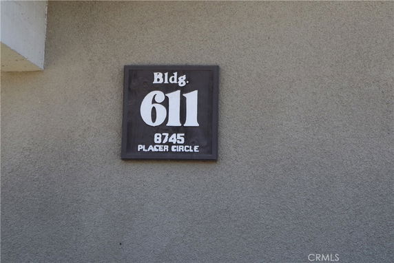 Exterior wall of a building with a sign reading 'Bldg. 611, 8745 Placer Circle.'