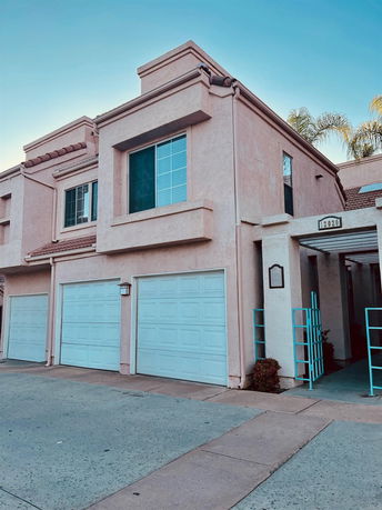 Front view of a two-story house with a double garage.