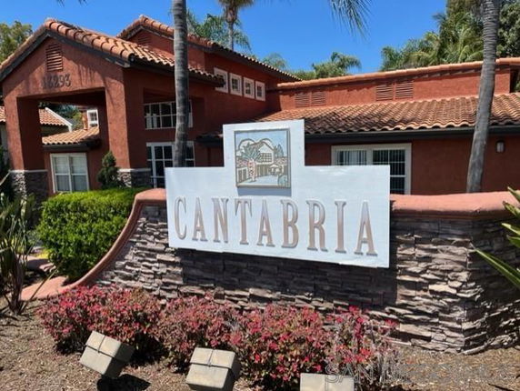 Front view of a building with red roof tiles and a sign reading 'Cantabria'.