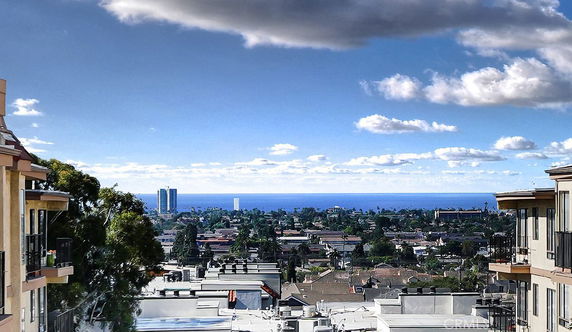 Panoramic view of buildings with ocean in the background.
