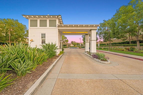 Entry gate with a driveway leading to parking area