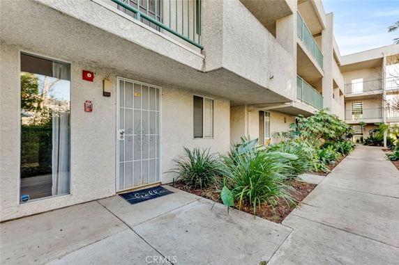 Exterior view of a multi-story apartment building with balconies.