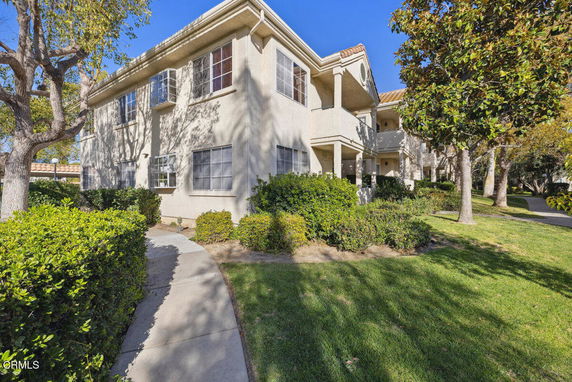 Front view of a two-story residential building with balconies.