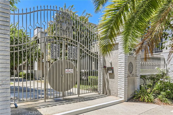 Front view of a gated entrance to a building with a metal gate.