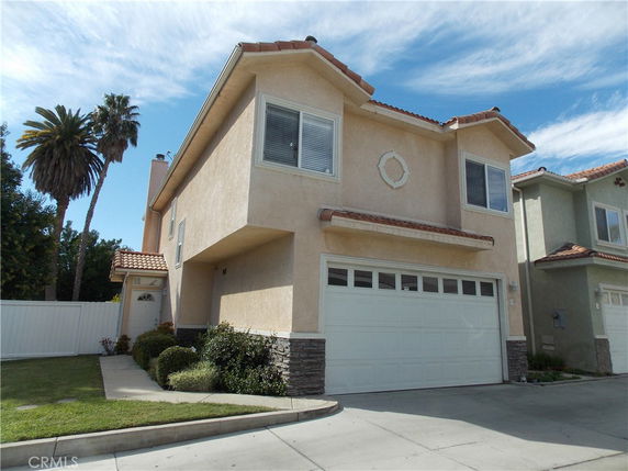 Front view of a two-story house with a double garage.