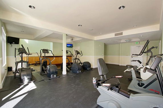 Interior view of a gym area with exercise equipment.