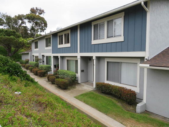 Front view of a two-story house with blue and white exterior.