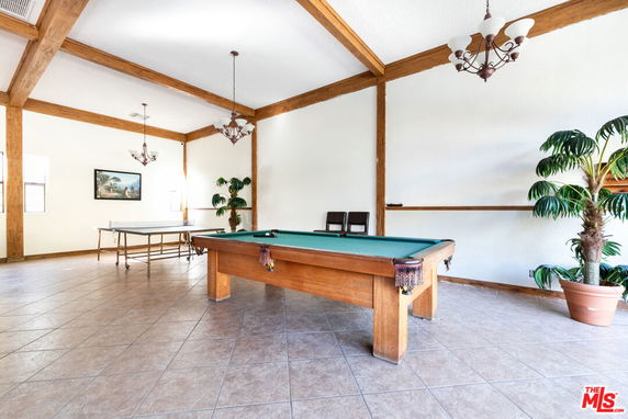 Interior view of a recreational room with a pool table.