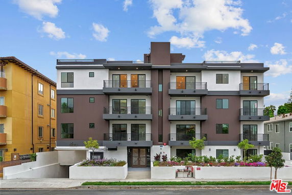 Front view of a modern multi-story apartment building