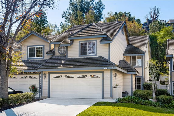 Front view of a two-story house with a double garage.