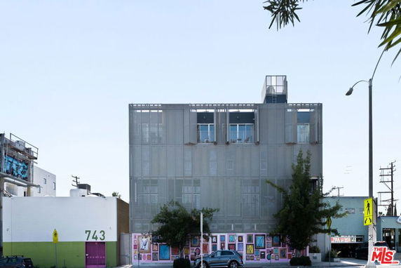 Front view of a multi-story building with a modern design.