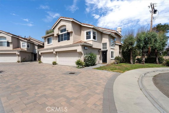 Front view of a two-story house with double garage.