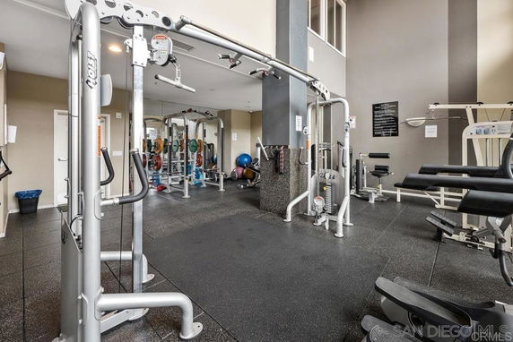 Indoor gym area with various exercise equipment.