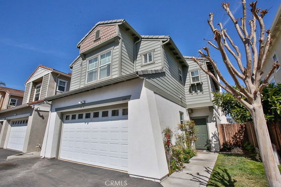 Front view of a two-story house with a double garage.