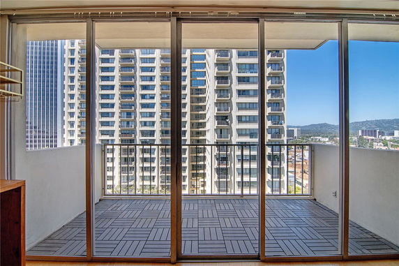 Panoramic view of surrounding buildings from a balcony.