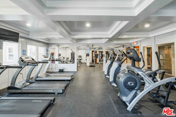 Interior view of a gym area with exercise equipment.